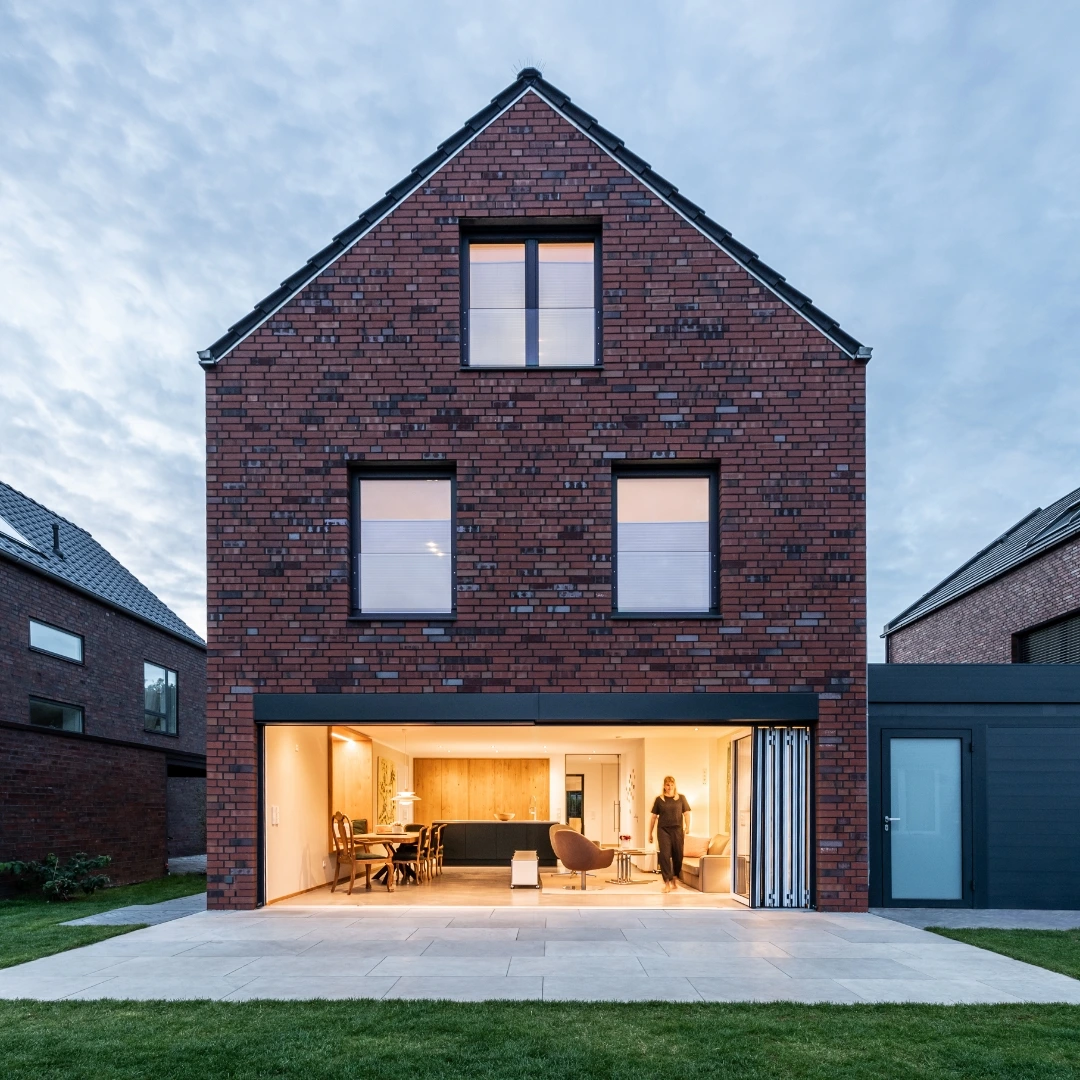Living room with open aluminium Highline bi-folding door 
